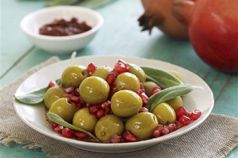 Olives marinated in pomegranate and sage