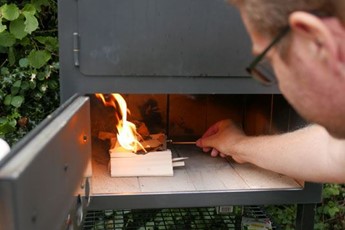 Lighting a wood-fired oven