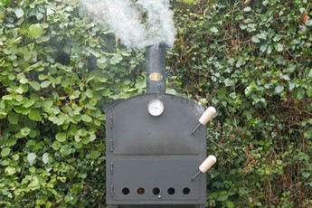 Smoking in a wood-fired oven