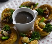 Mini Yorkshire puddings with sausages and roast shallot gravy recipe